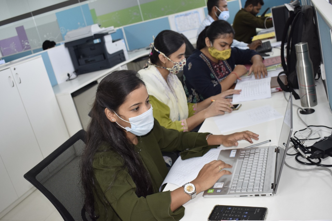 TULIP interns working inside a municipal office